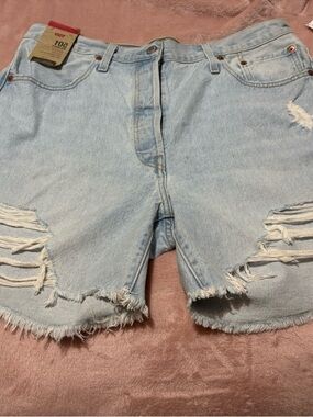 Levi's 501 high-rise distressed denim shorts.